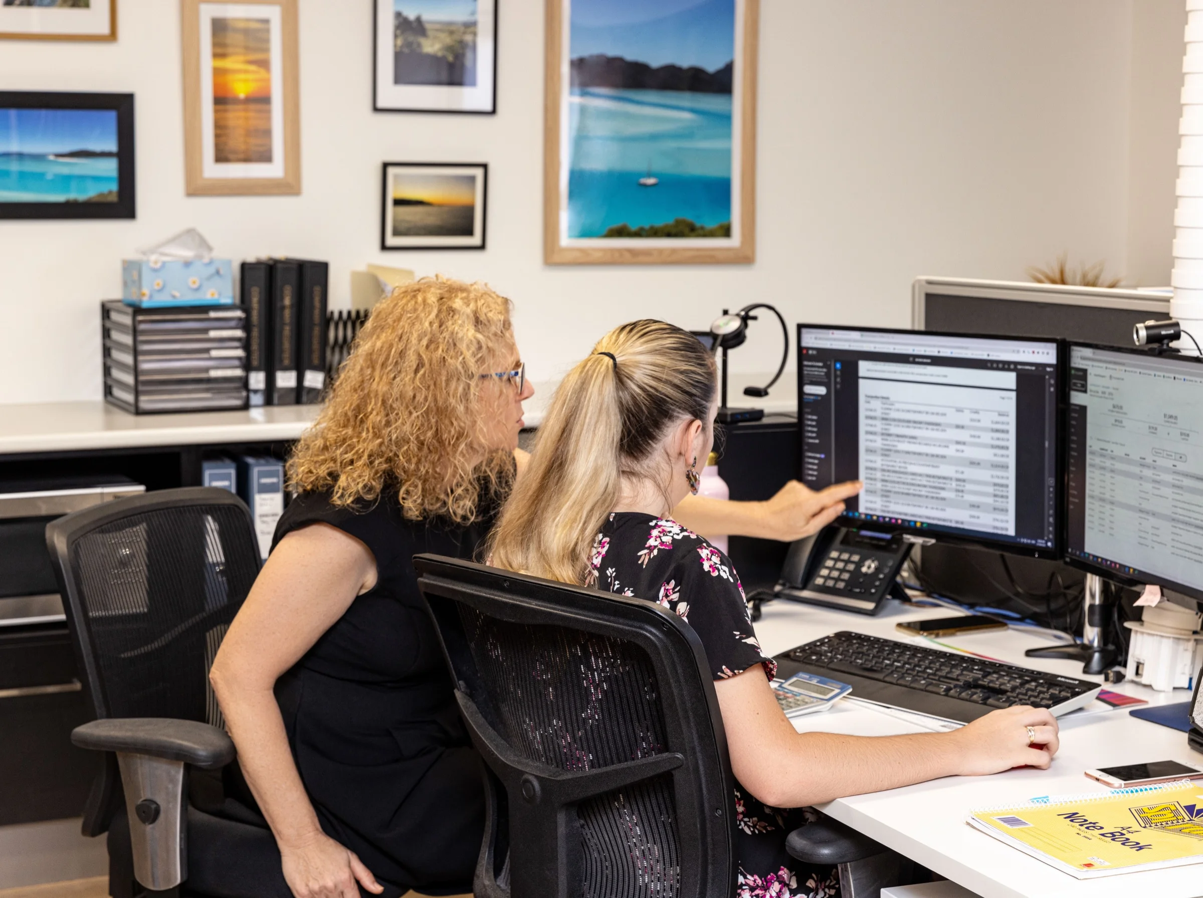 Ready Accounting advisers reviewing business financials with a client